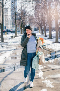 Full length of young man standing in snow