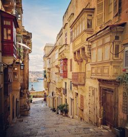 Narrow alley amidst buildings in town