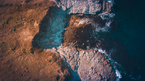 Aerial view of rock formations and sea