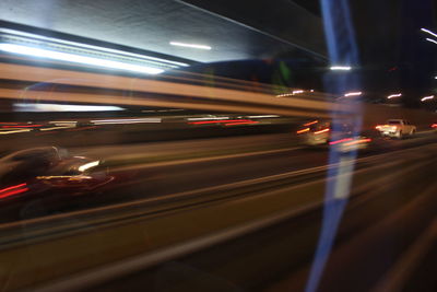 Light trails on street in city at night