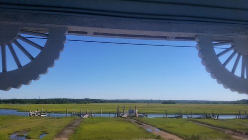 View of footpath against clear sky