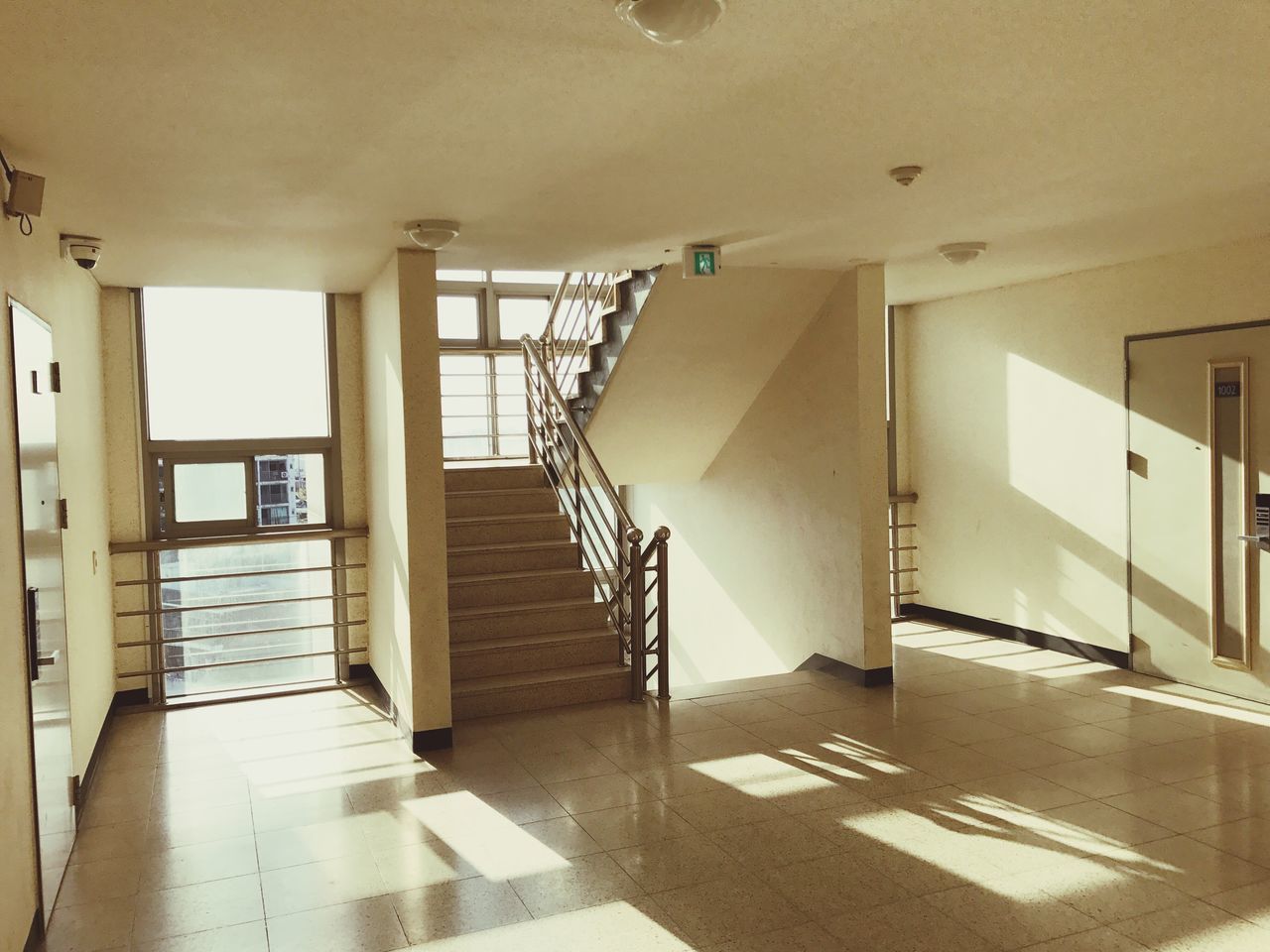 indoors, railing, sunlight, architecture, no people, day, the way forward, staircase, built structure, steps and staircases