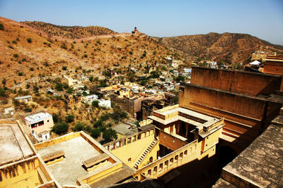 High angle view of townscape and mountains