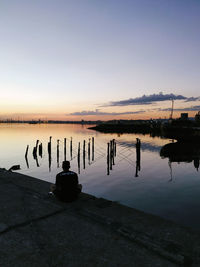 Scenic view of lake against sky during sunset