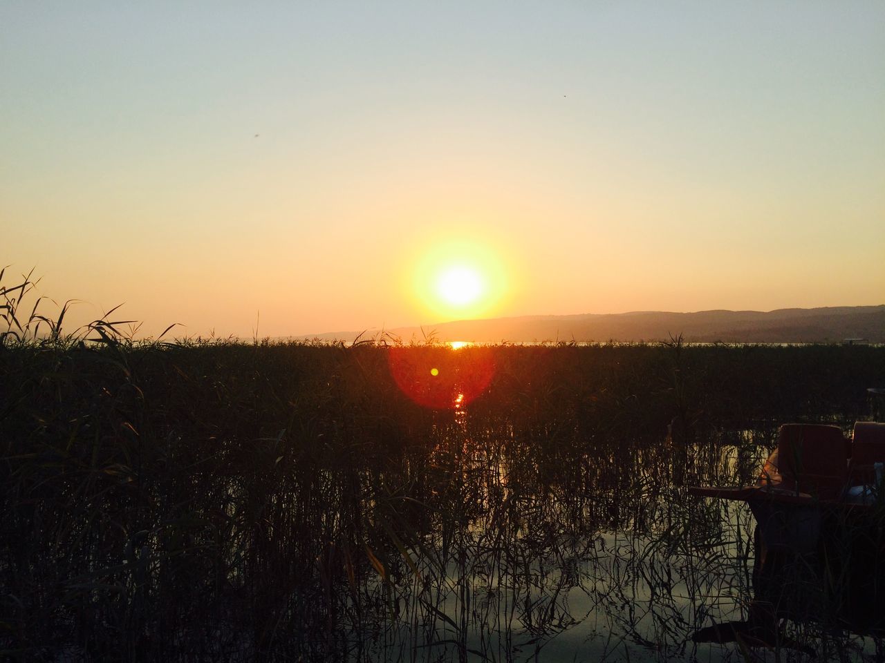 sunset, sun, water, tranquil scene, scenics, clear sky, tranquility, orange color, beauty in nature, copy space, sea, nature, horizon over water, idyllic, sunlight, sky, silhouette, reflection, lake, landscape