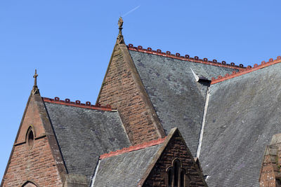 Low angle view of traditional building against clear blue sky