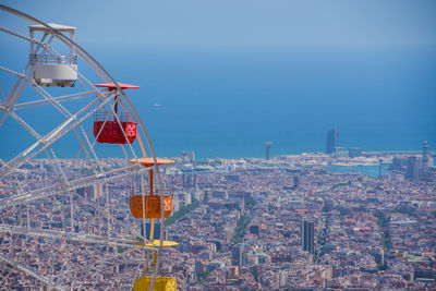 High angle view of buildings by sea against clear sky