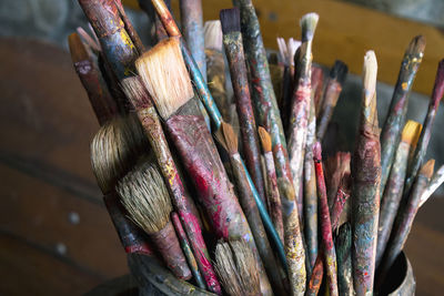 Close-up of paintbrushes in container