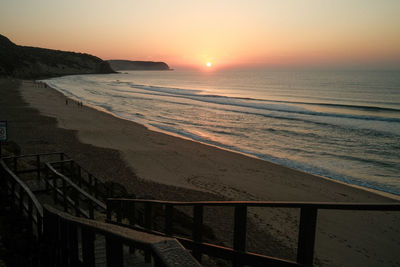 Scenic beach view during sunrise in salema, algarve, portugal. shot on fujifilm x100v.