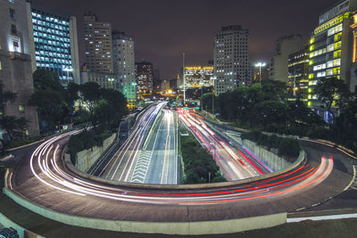 High angle view of light trails on road at night