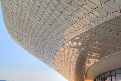 Low angle view of bridge and building against sky