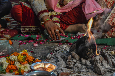 Just before groom going to put red colorsindoor on bride head in ritual in indian marriage.