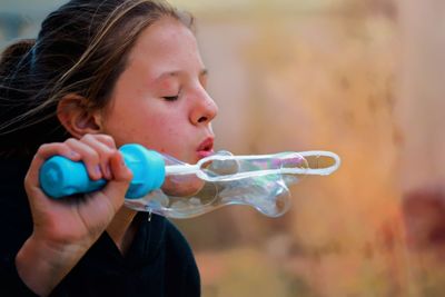 Close-up portrait of girl with bubbles