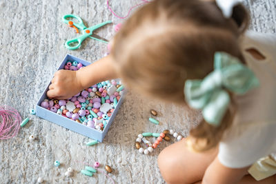 High angle view of boy playing with toy blocks