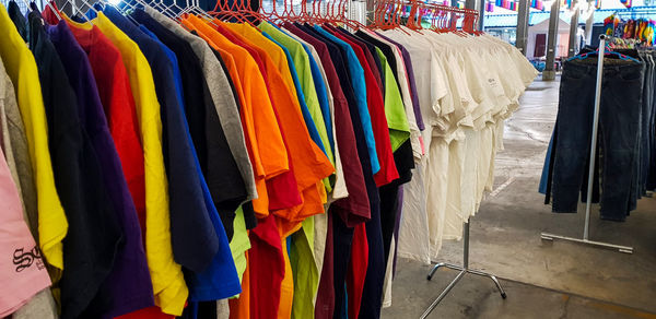 Multi colored flags hanging in row at store