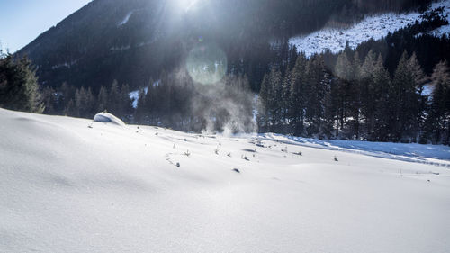 Scenic view of snow covered mountains