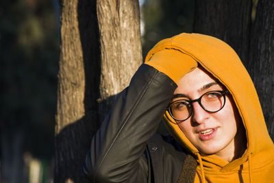 Young adult woman portrait at sunset in the park, tbilisi, georgia