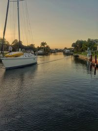 Boats moored in river