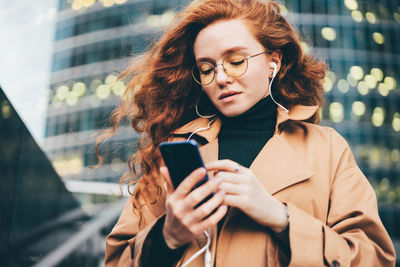 Young woman using mobile phone