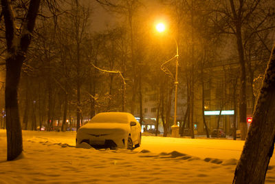 Car on street at night during winter