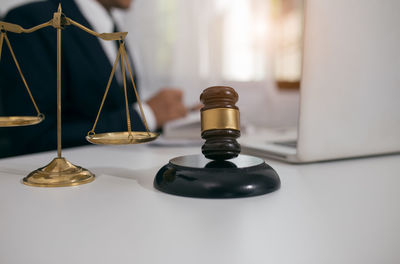 Close-up of clock on table