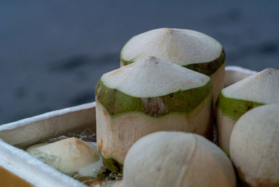 Close-up of sliced fruits on wood