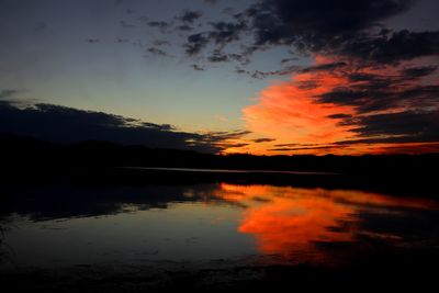 Scenic view of lake against romantic sky at sunset