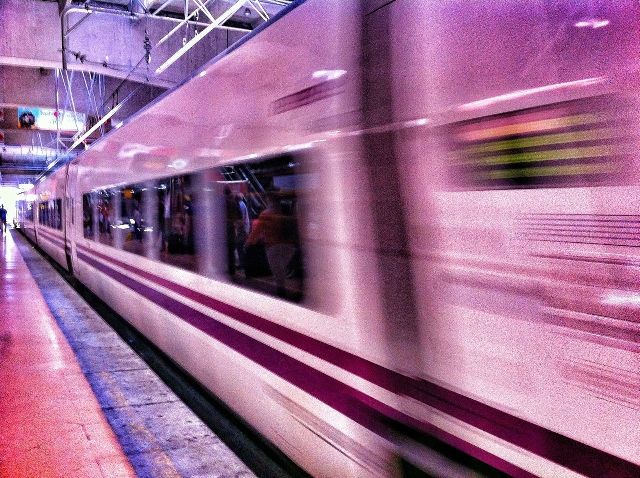 transportation, indoors, mode of transport, built structure, architecture, public transportation, railroad track, blurred motion, rail transportation, railroad station platform, railroad station, motion, travel, land vehicle, building exterior, illuminated, on the move, train - vehicle, window, passenger train