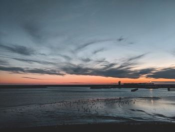 Scenic view of sea against sky at sunset