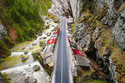 Aerial view of road and shops in mountain canyon