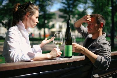 Young couple sitting on table at restaurant