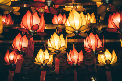 Traditional chinese lotus lamp hanging on the ceiling with wishes.