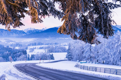 Scenic view of snow covered mountains against sky