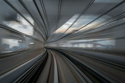 Blurred interior of railroad tracks in tunnel