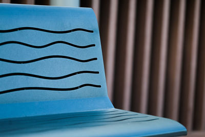 Close-up of blue table against wall at home