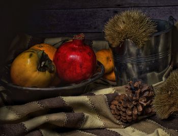 Close-up of fruits in container on table