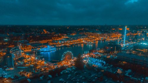 High angle view of illuminated buildings in city at night