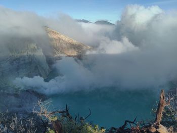 Panoramic view of volcanic mountain and sulfur smoke