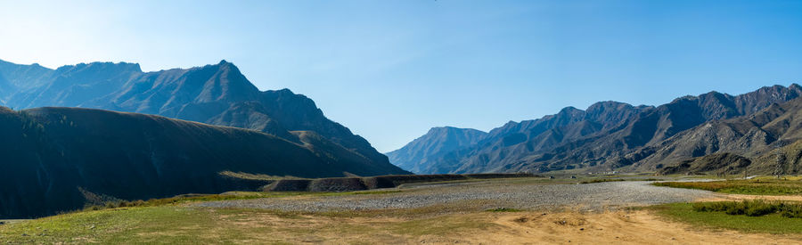 Scenic view of landscape and mountains against sky