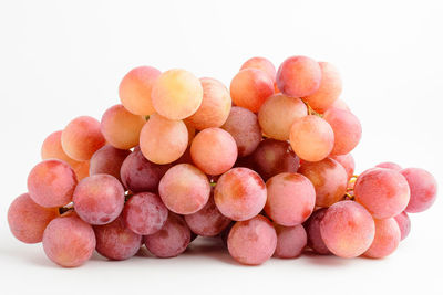 Close-up of grapes against white background