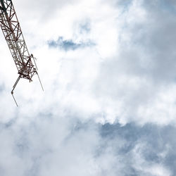 Low angle view of communications tower against sky