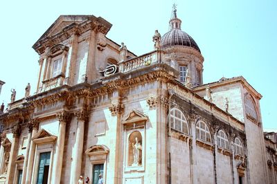 Low angle view of dubrovnik cathedral against sky on sunny day