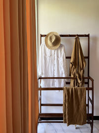 Rear view of woman standing by window