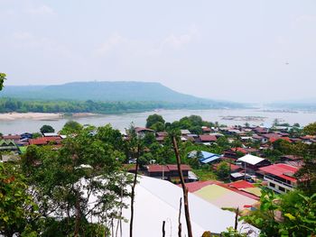 Scenic view of sea and buildings against sky