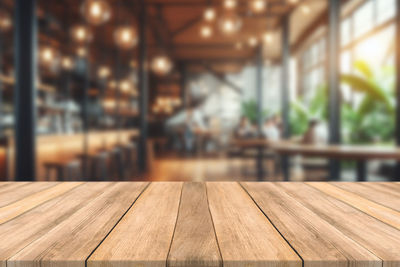 Close-up of wooden table at restaurant