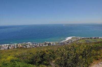 High angle view of sea against clear blue sky