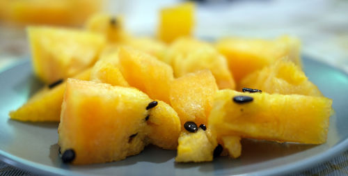 Close-up of yellow fruit in plate