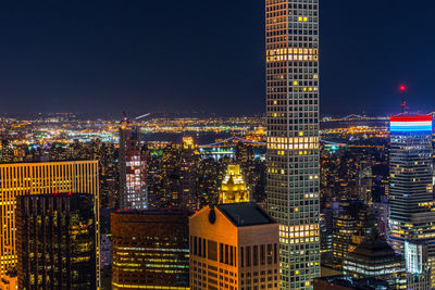 Illuminated buildings in city at night