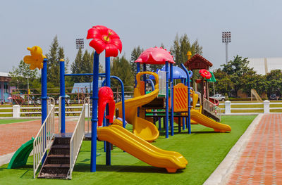 Playground in park against sky