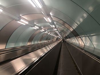 Low angle view of illuminated tunnel